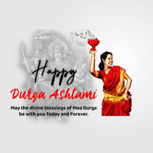 A woman in traditional attire celebrating Durga Ashtami with a depiction of Goddess Durga in the background.