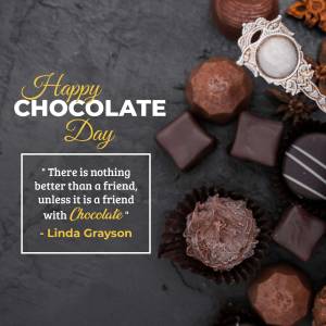 Assortment of chocolates and a decorative silver frame with a quote for Chocolate Day.