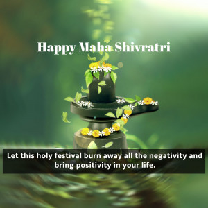 Image depicting a Shivling decorated with flowers and leaves with the text 'Happy Maha Shivratri'