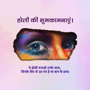 A face partially covered with colorful Holi powder, with striking blue eyes.