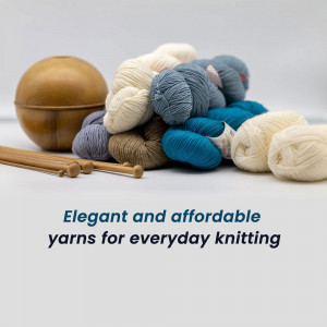A collection of colorful yarn balls and knitting needles on a white surface.