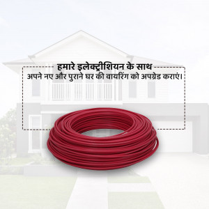 Red electrical wire coil in front of a house, advertising electrical wiring services.
