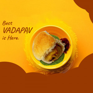 Close-up of a Vada Pav served on a yellow plate with a vibrant orange background.