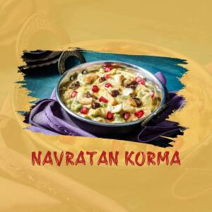 Close-up of Navratan Korma, a creamy Indian curry with nine jewels of fruits and nuts.