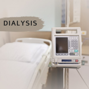 Close-up of a dialysis machine connected to a hospital bed.