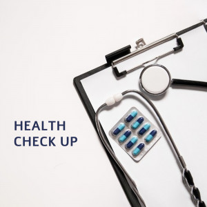 Clipboard with pills, stethoscope, and text 'HEALTH CHECK UP'