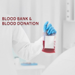 A gloved hand holding a bag of blood in a blood bank setting.
