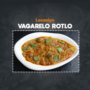 A close-up of Vagarelo Rotlo, a traditional Gujarati dish, served in a white bowl.