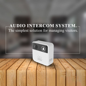 White audio intercom system on a wooden surface