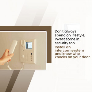 Close-up of a white intercom system mounted on a wall with a hand reaching for the receiver.