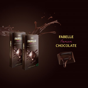 Two boxes of Fabelle dark chocolate with melting chocolate splash