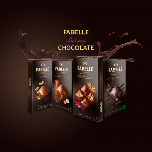 Assortment of Fabelle luxury chocolate bars with flowing chocolate