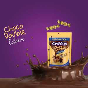A promotional image of Candyman Choco Double Eclairs Birthday Pack with chocolate splash.