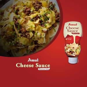 Close-up of nachos covered in Amul cheese sauce and ground beef, with an Amul Cheese Sauce bottle.