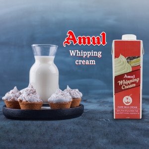 Amul Whipping Cream with glass of milk and desserts