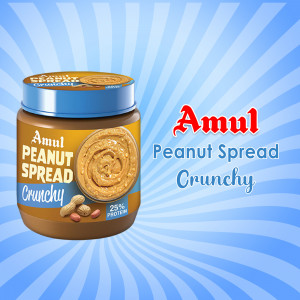A jar of Amul Crunchy Peanut Spread with a burst of light behind it.
