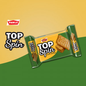 Pack of Parle Top Spin biscuits on a yellow and green background