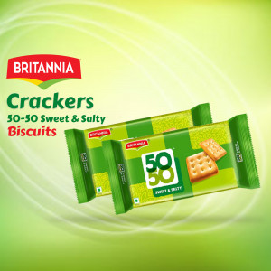 Two packs of Britannia 50-50 Sweet & Salty Crackers biscuits against a green gradient background.