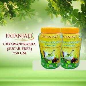 Two jars of Patanjali Chyawanprabha Sugar Free 750gm on a green background