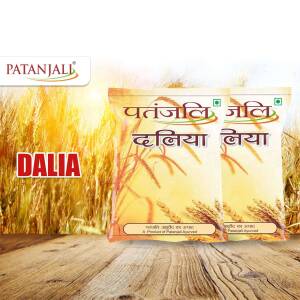 Two packets of Patanjali Dalia with wheat grain background