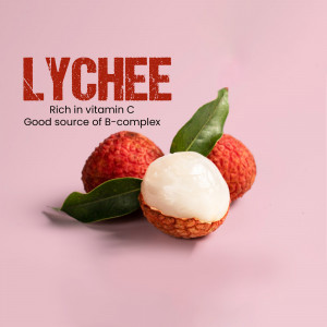 Close-up of fresh lychees with one peeled, showcasing the white flesh.