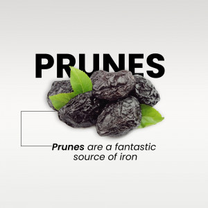Close-up of prunes with green leaves and text 'Prunes'