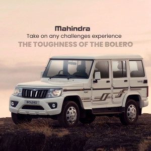 White Mahindra Bolero SUV parked on a rocky terrain