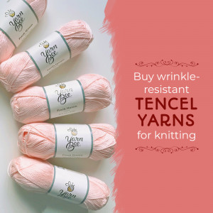 Close-up of pink Yarn Bee Tencel yarn balls with promotional text.