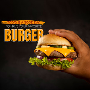 A hand holding a juicy cheeseburger with melted cheese and fresh toppings.