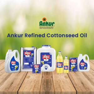 Assortment of Ankur Refined Cottonseed Oil packaging on a wooden surface