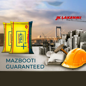 Three bags of JK Lakshmi Pro+ Cement with a hard hat and city skyline in the background.