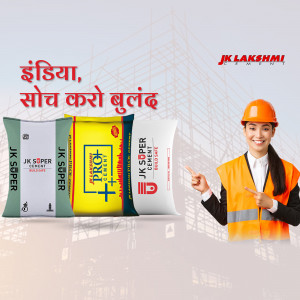 JK Lakshmi Cement bags with a construction worker pointing towards them