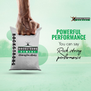 A hand gripping a bag of Rockstrong Cement with a blurred background and text promoting powerful performance.