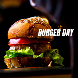 Close-up of a delicious burger with sesame seed bun, lettuce, tomato, and meat patty.