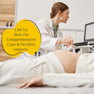 Doctor performing an ultrasound on a pregnant patient