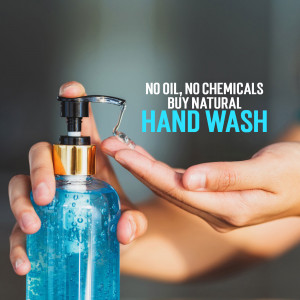 Close-up of hand dispensing natural hand wash from a pump bottle.