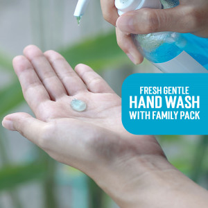Close-up of hand receiving blue hand wash gel