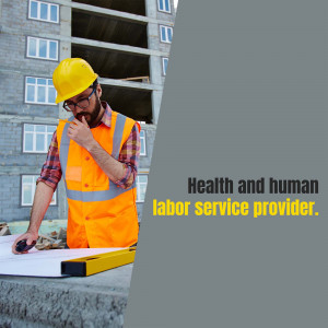 Construction worker in safety vest reviewing blueprints on a construction site.