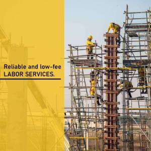 Construction workers on scaffolding building a concrete structure