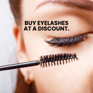Close-up of a woman's eye with a mascara wand applying eyelashes