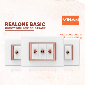 Three white switch panels with rose gold frames