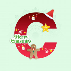 Red letter C decorated with Christmas ornaments and a gingerbread man