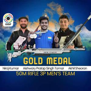 Indian shooting team celebrating a gold medal win in the 50m Rifle 3P event.