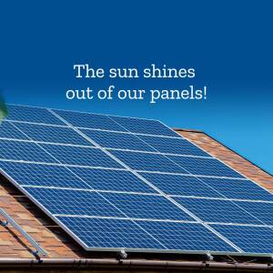 Solar panels on a roof under a blue sky