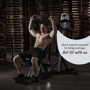 Man lifting weights on a bench press in a gym