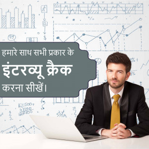 A man in a suit sitting with a laptop in front of financial charts and graphs.