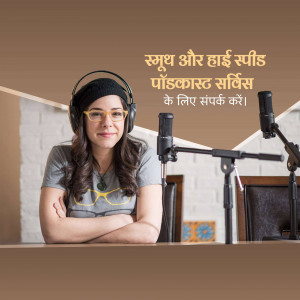 Woman wearing headphones and smiling in front of a microphone.