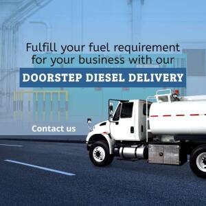 Diesel delivery truck parked in front of fuel tanks