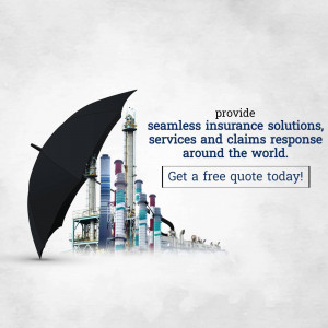 An umbrella protecting industrial buildings, representing insurance coverage.