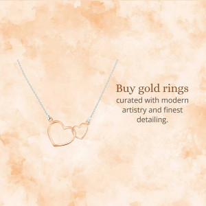 Close-up of a delicate gold necklace with interlocking heart pendants.